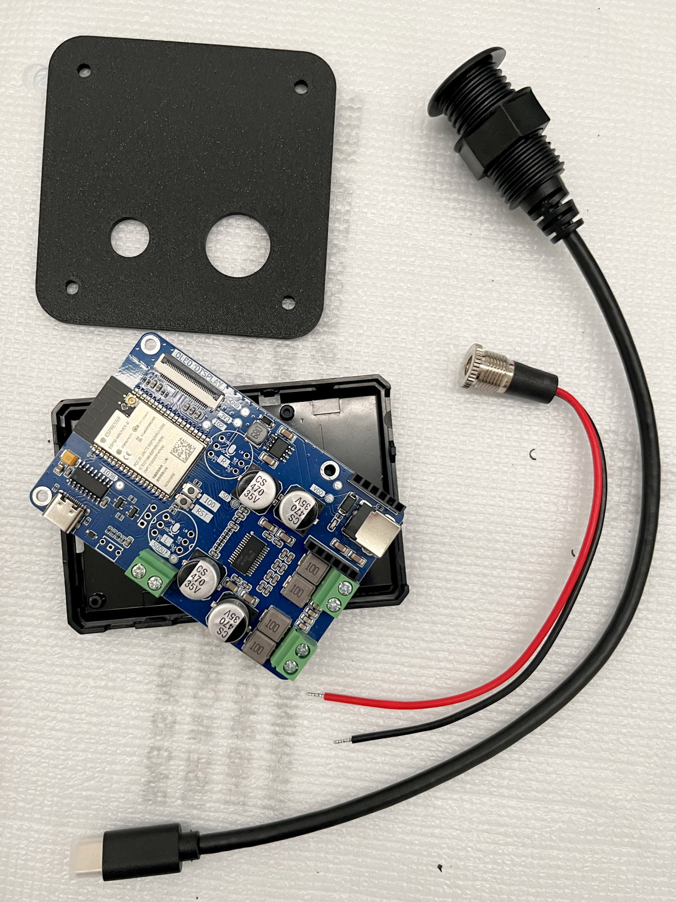 ESP32 board connector cables and 3D-printed back plate laid out for the build