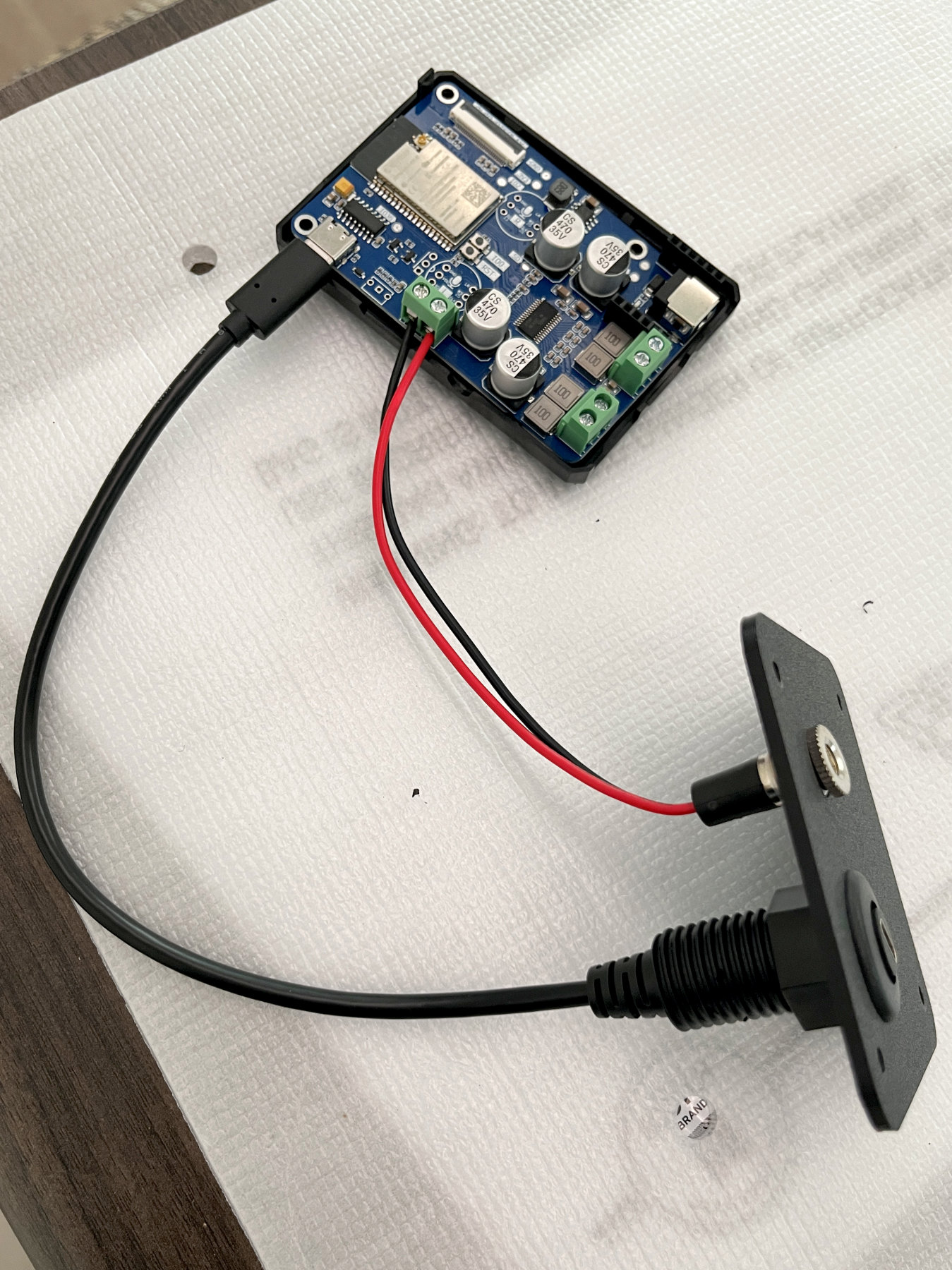 Assembled LOUDER PLUS ESP32 controller board mounted to the 3D-printed back plate with USB-C and DC connectors